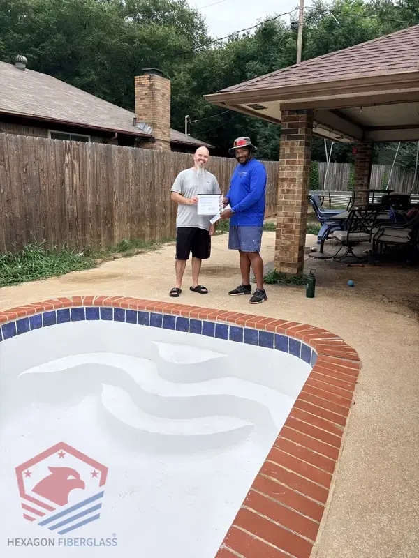 Hexagon Fiberglass Pools customer with their warranty documentation