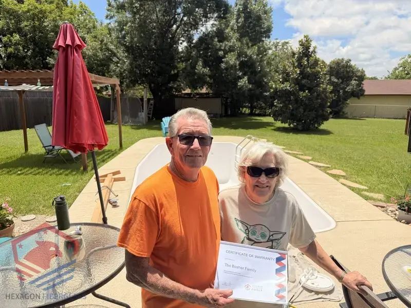 Hexagon Fiberglass Pools customer with their warranty documentation