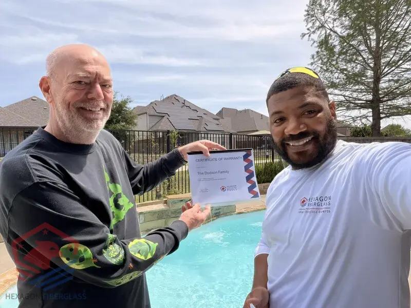 Hexagon Fiberglass Pools customer with their warranty documentation